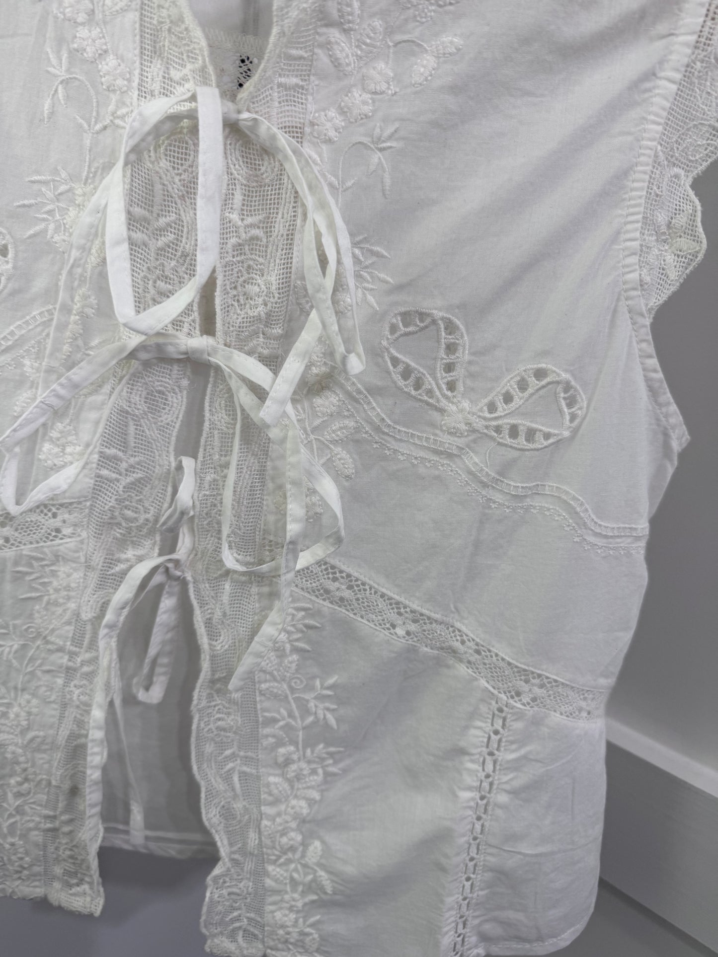 White eyelet sleeveless top