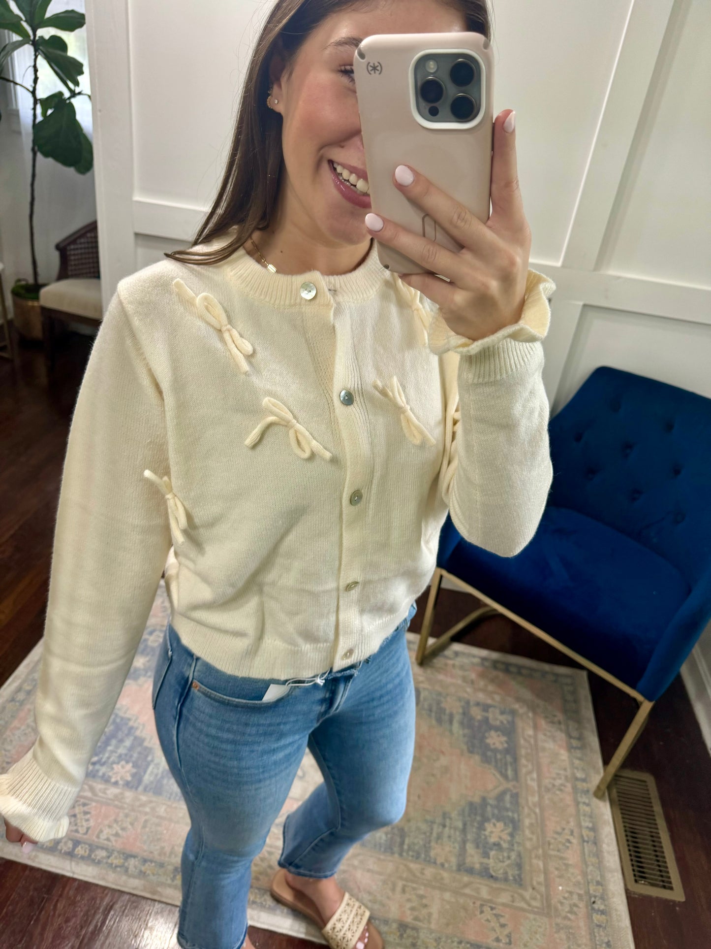 Ivory bow cardigan sweater