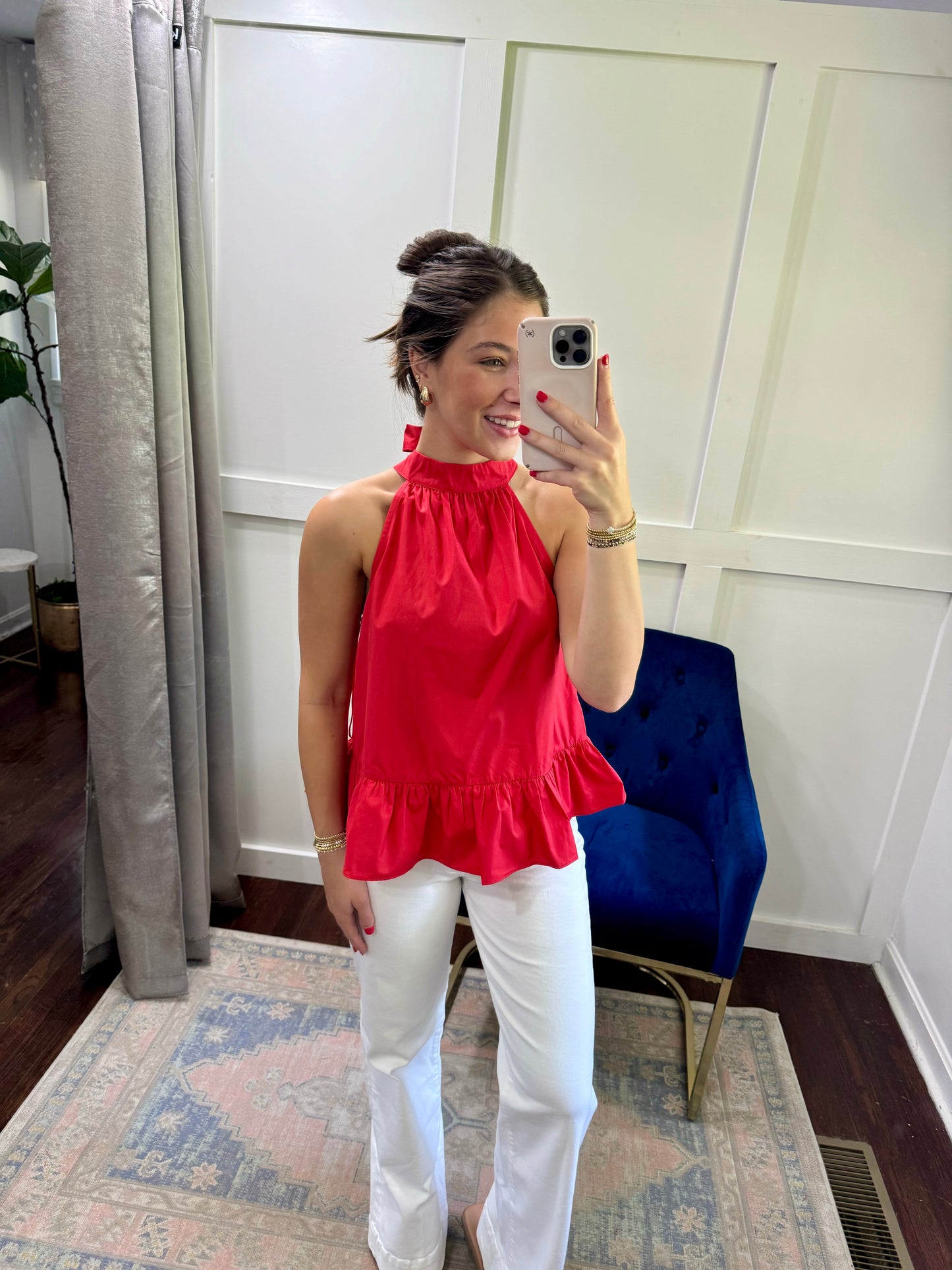 Red halter back bow top