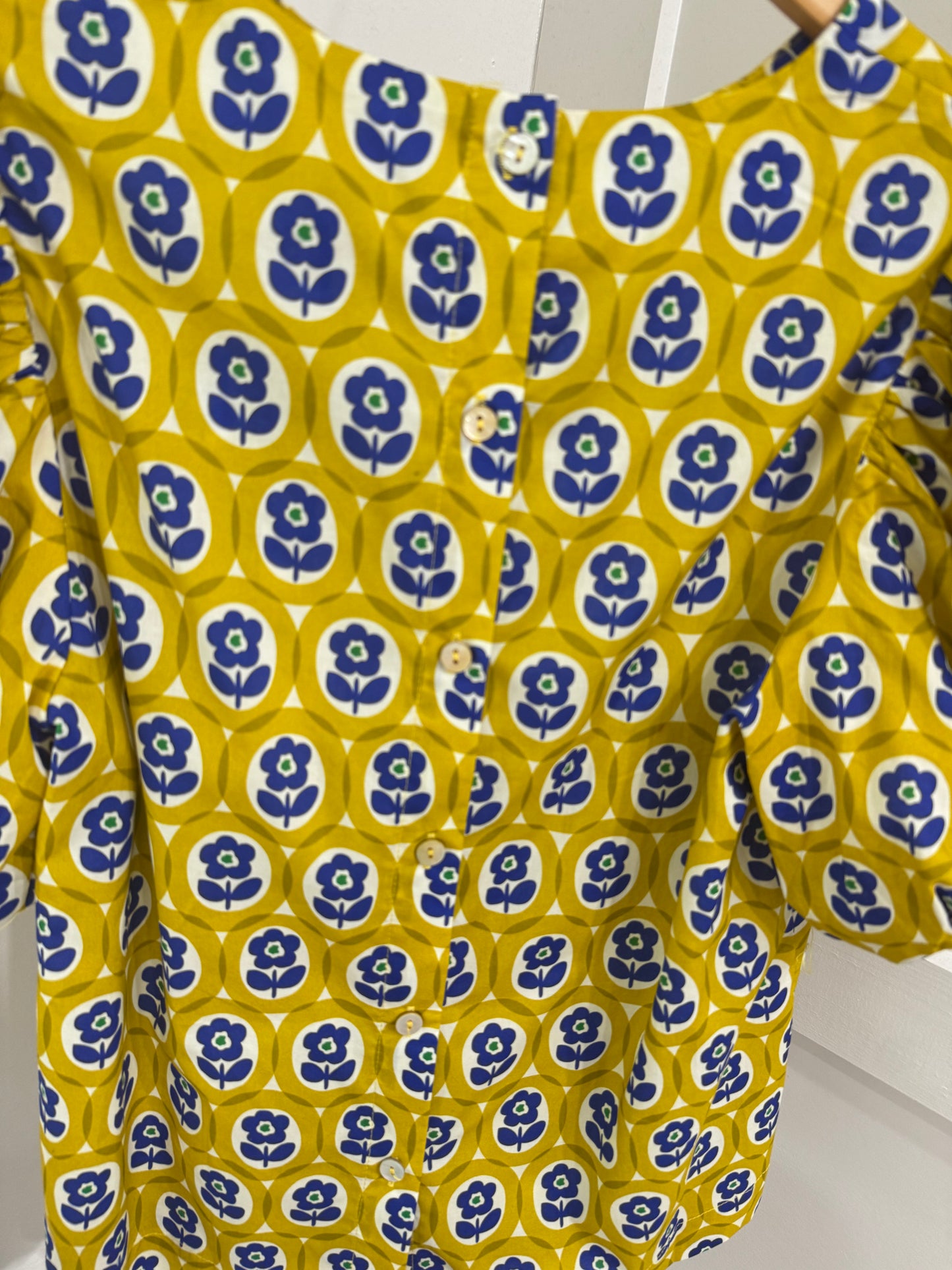 Yellow and blue flower top